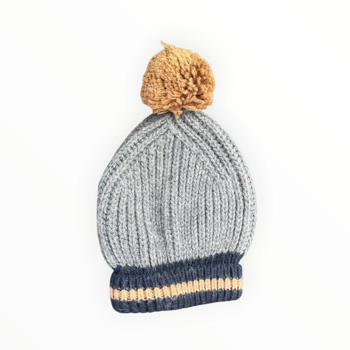 Pierrot Outlet grey ribbed knit winter beanie with a navy cuff, tan stripe, and a fluffy tan pom-pom on top.