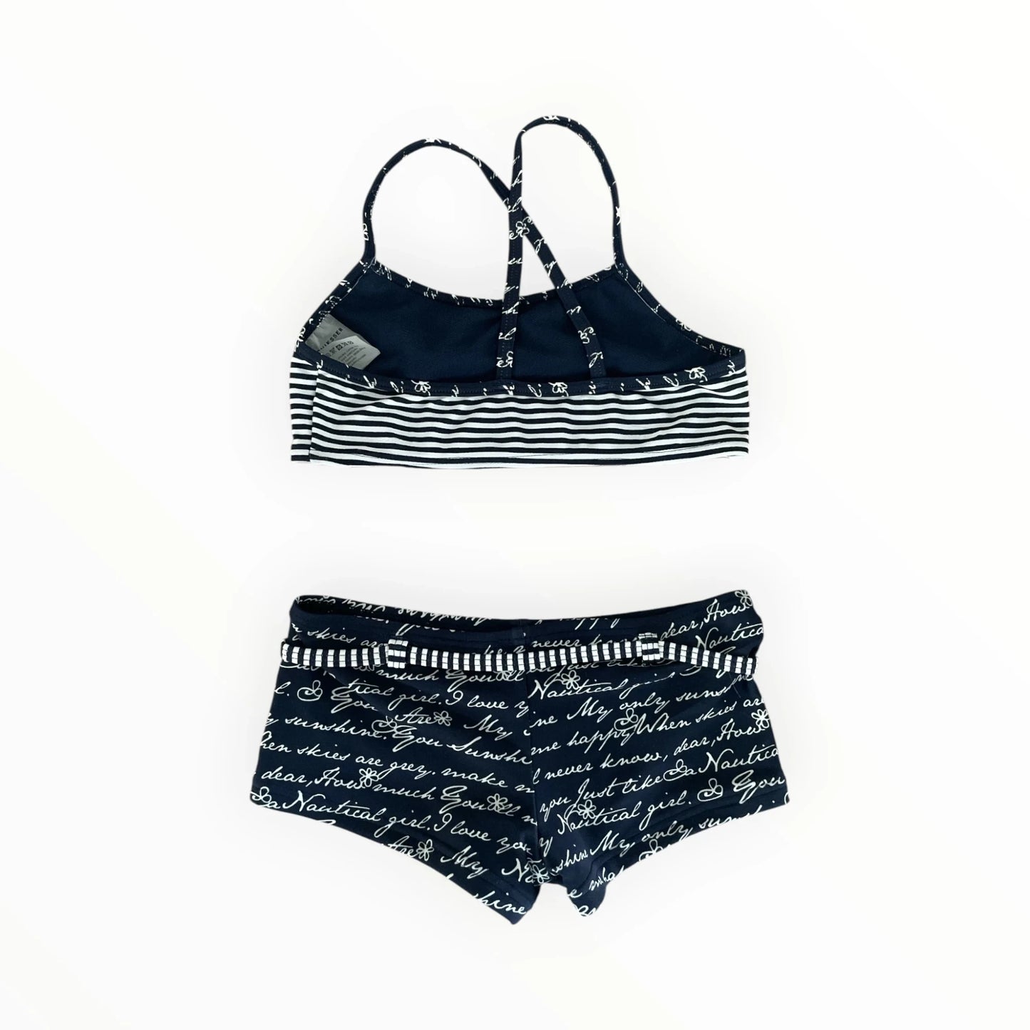 Pierrot Outlet marineblauwe meisjesbikini met tekstprint, gestreepte top met gekruiste rug en bijpassend broekje.