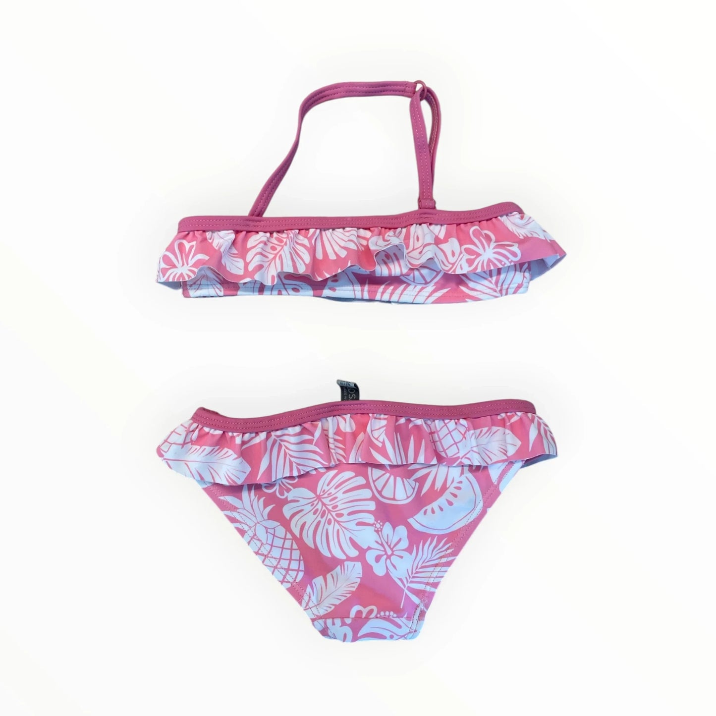 Pierrot Outlet roze bikini voor meisjes met tropische print, ruches en nekbandje voor zwemmen en strand.