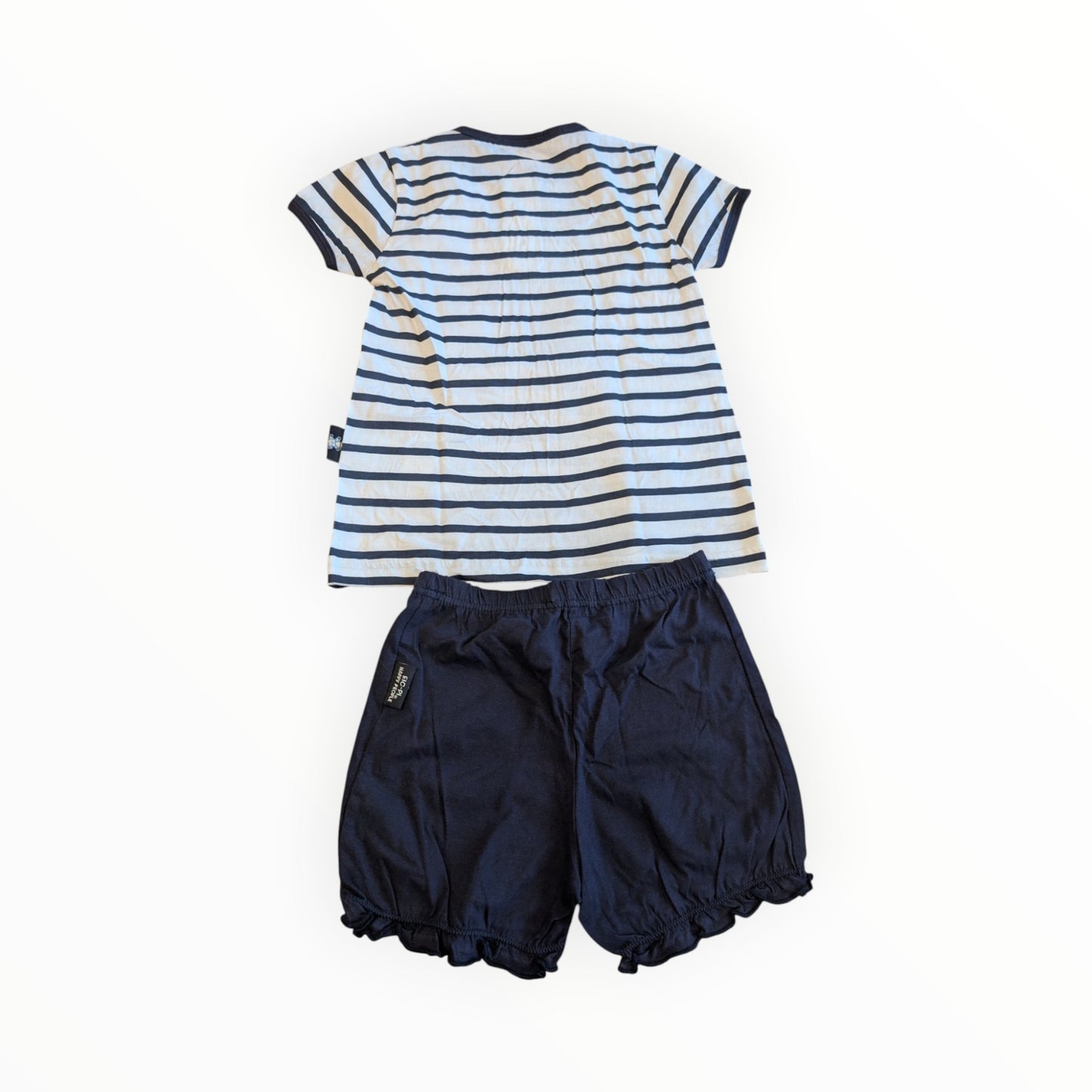 Pierrot Outlet zomerse set met wit-blauw gestreept T-shirt en donkerblauwe short met ruches voor kinderen