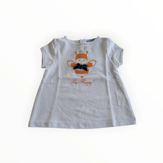 Pierrot Outlet baby meisje t-shirt jurk met korte mouwen, bijenprint en 'Bee Happy!' tekst. Gemaakt van katoen.