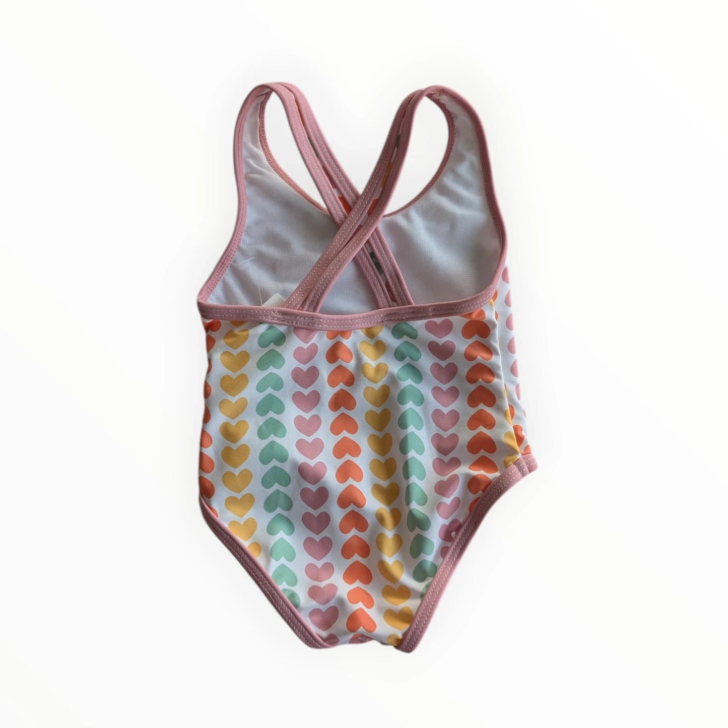 Pierrot Outlet baby meisjes badpak met hartjesprint in pastelkleuren en roze biesje. Gekruiste bandjes op de rug.