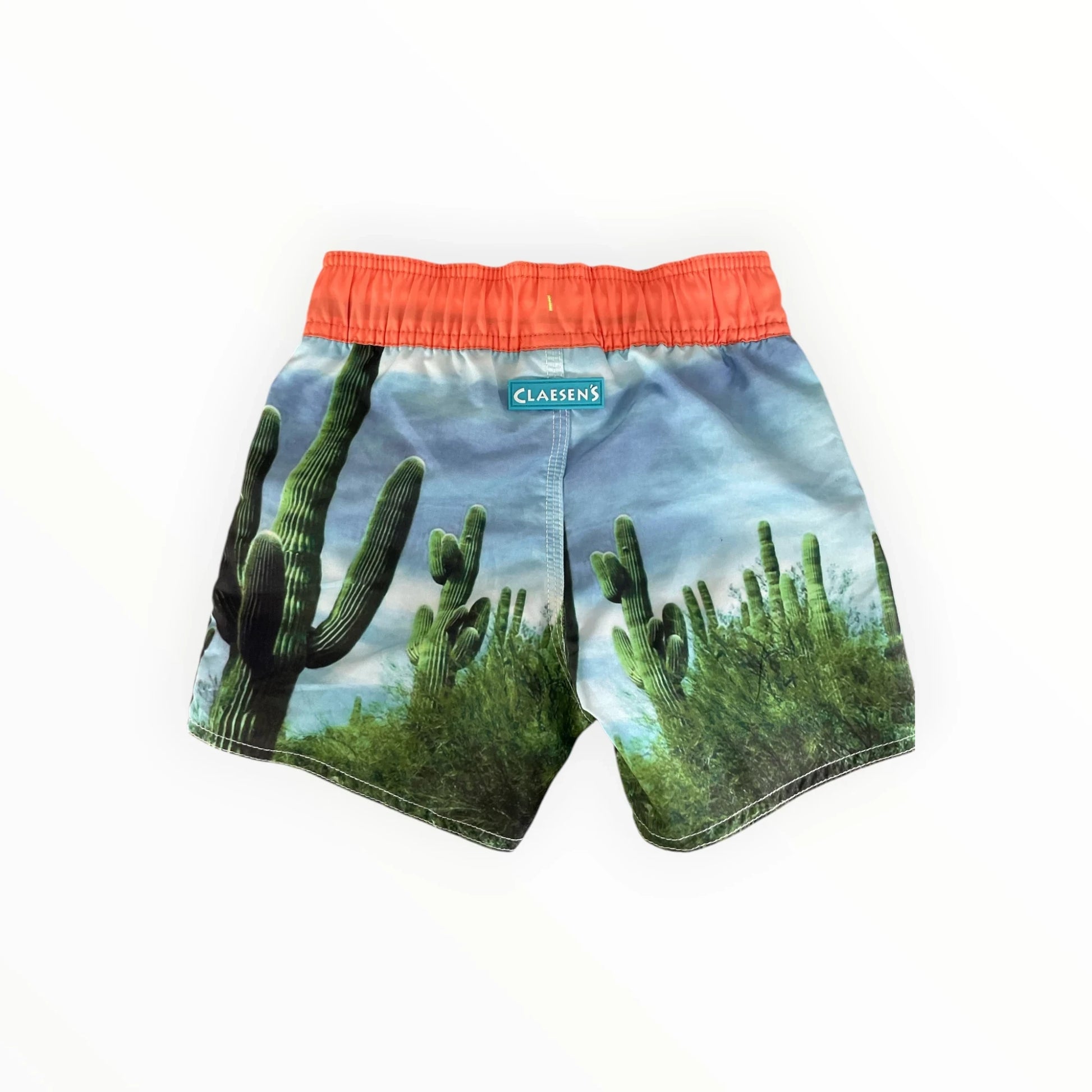 Claesen's jongens zwemshort met cactusprint en oranje tailleband, verkrijgbaar bij Pierrot Outlet.