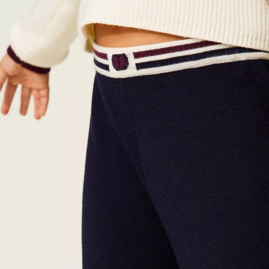Pierrot Outlet donkerblauwe gebreide kinderbroek met wijde pijpen en een gestreepte elastische tailleband