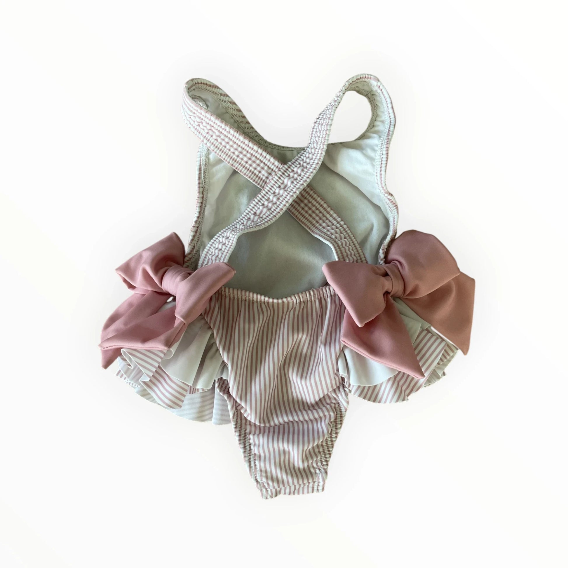 Pierrot Outlet gestreept baby zwempak met roze strikjes, ruches en gekruiste schouderbandjes voor meisjes.