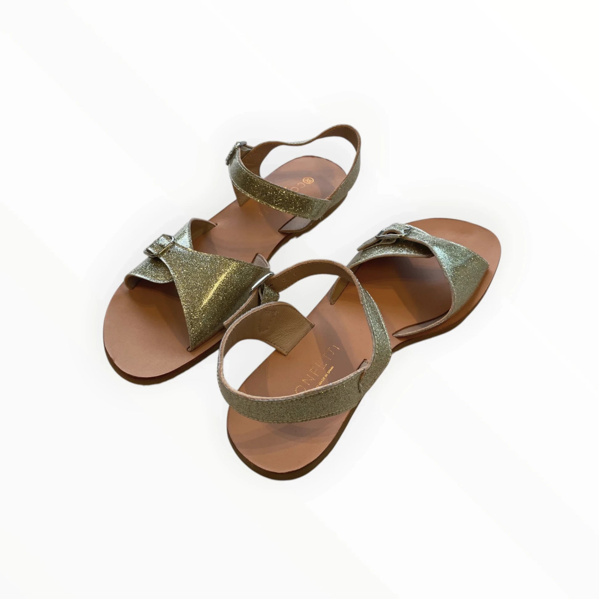 Pierrot Outlet gouden glitter sandalen met verstelbare enkelband en leren zool. Stijlvol en comfortabel voor dames.