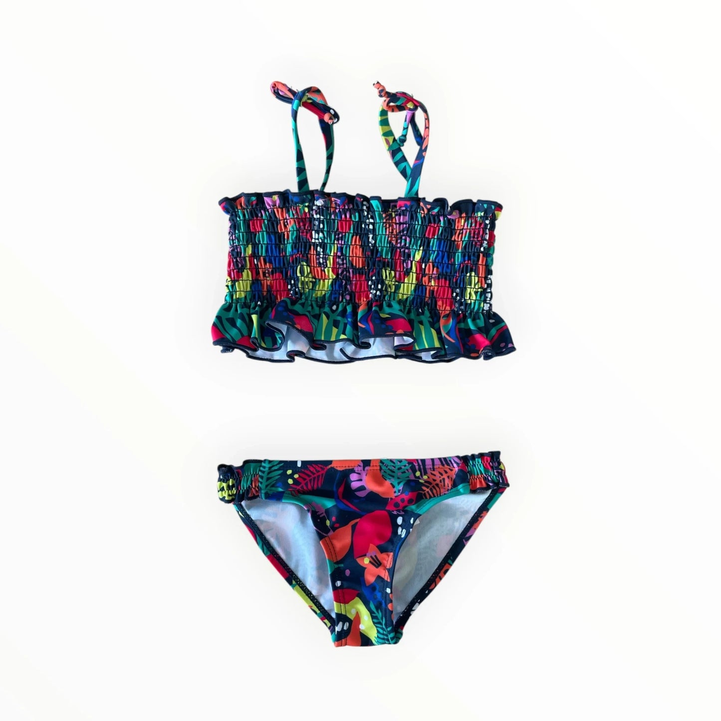 Pierrot Outlet tweedelige bikini voor kinderen met tropische print, gesmokt topje met ruches en verstelbare bandjes.