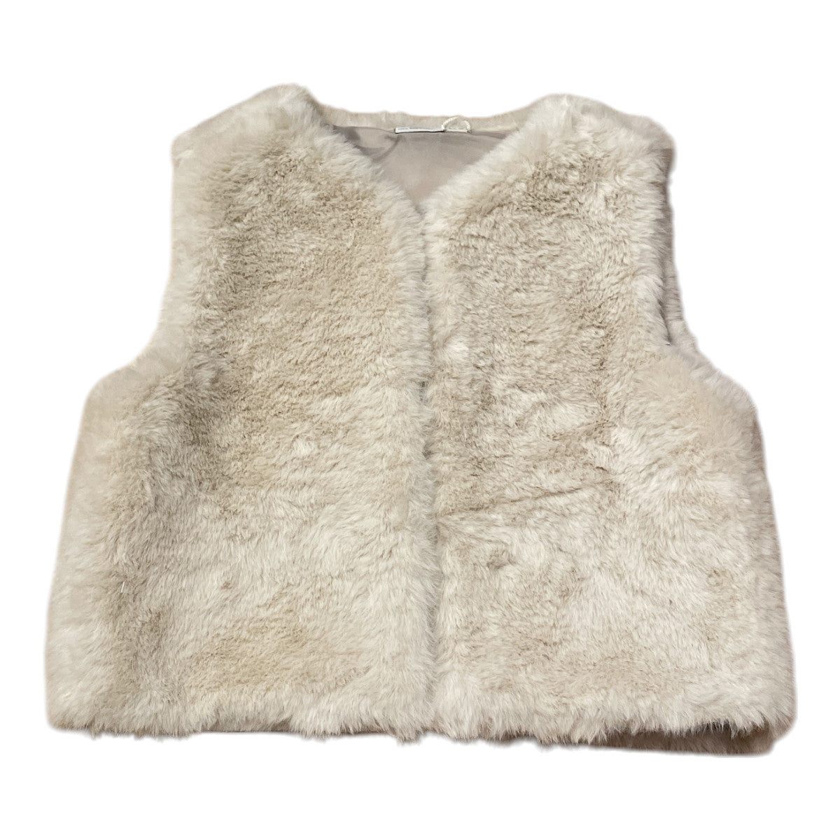 Pierrot Outlet crèmekleurig imitatiebont vest voor kinderen, mouwloos en open aan de voorkant.