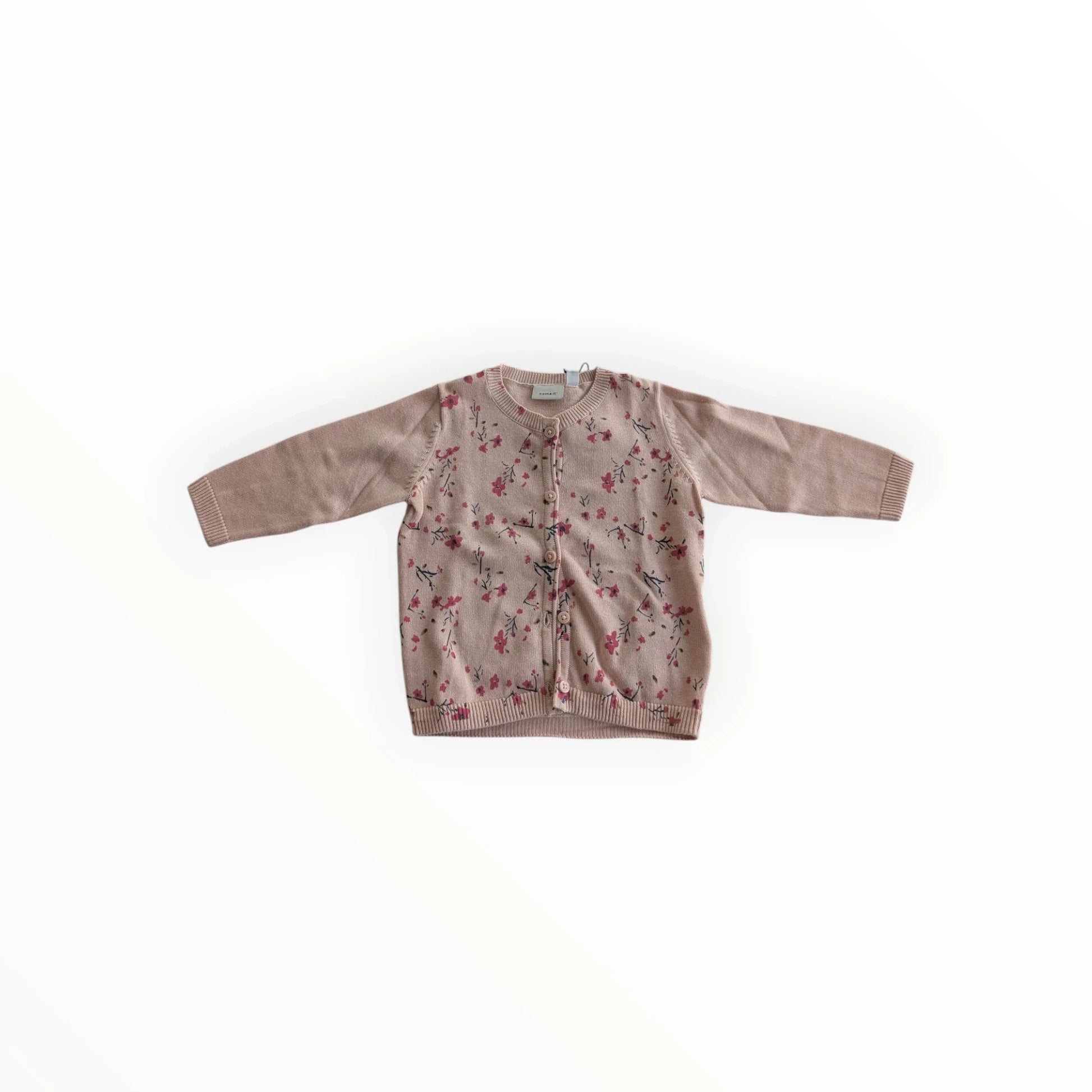 Pierrot Outlet gebreid vest met bloemenprint in roze en rood voor kinderen, met knoopsluiting.
