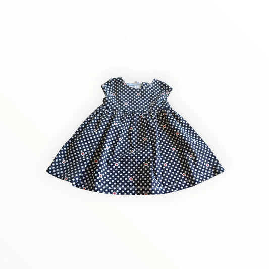 Pierrot Outlet marineblauwe babyjurk met witte polkadots en rode hartjes, korte mouwen en wijde rok.