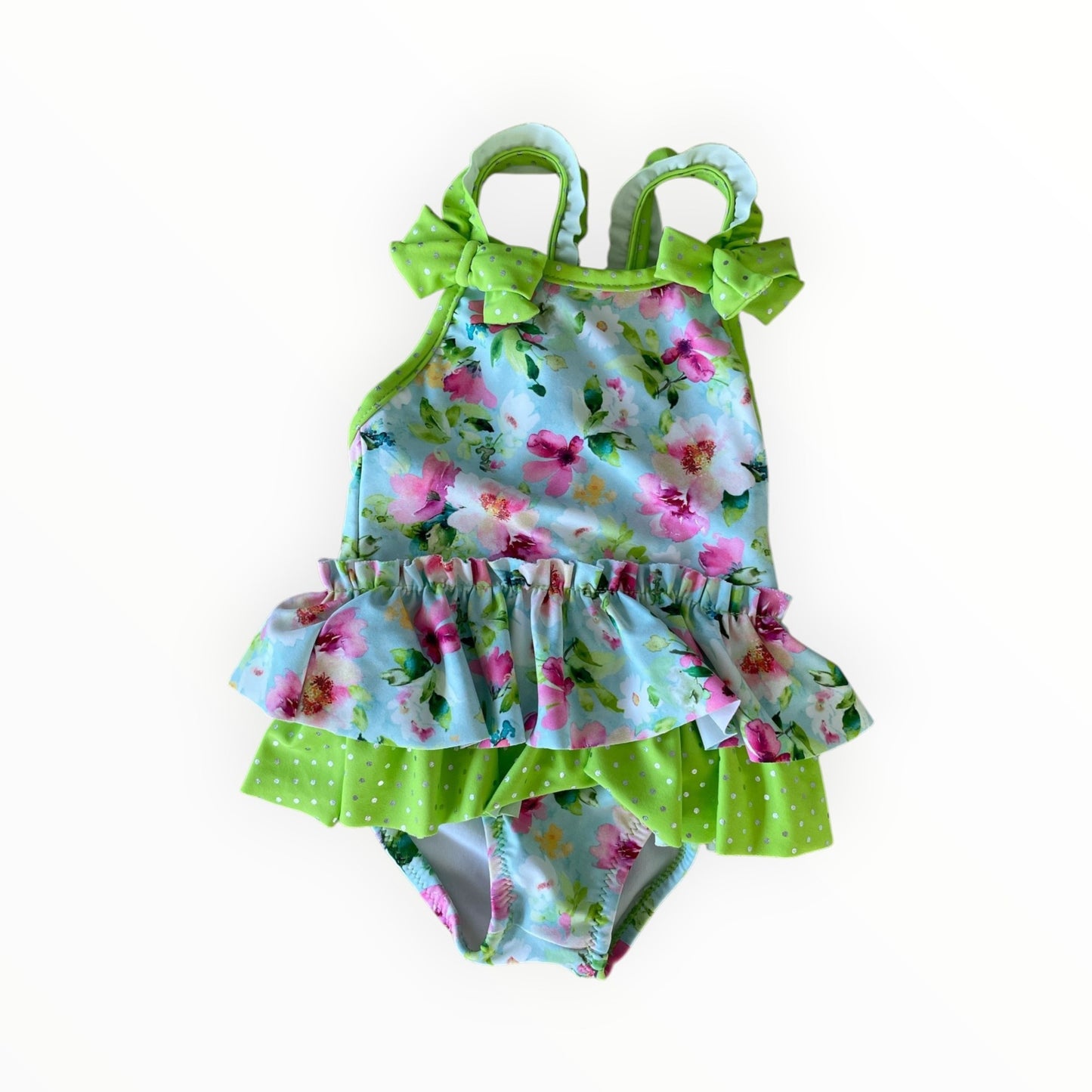 Mayoral zwempak van Pierrot Outlet met bloemenprint, ruches, strikjes en limegroene accenten voor meisjes.