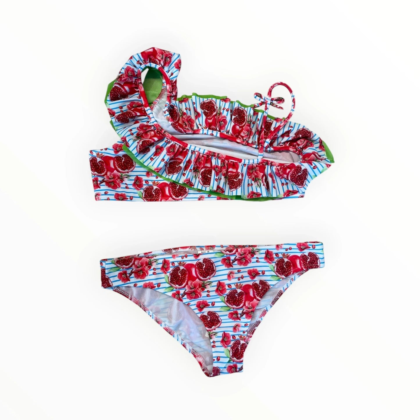 Pierrot Outlet meisjesbikini met granaatappelprint, blauwe strepen, asymmetrische halslijn en groene ruches.