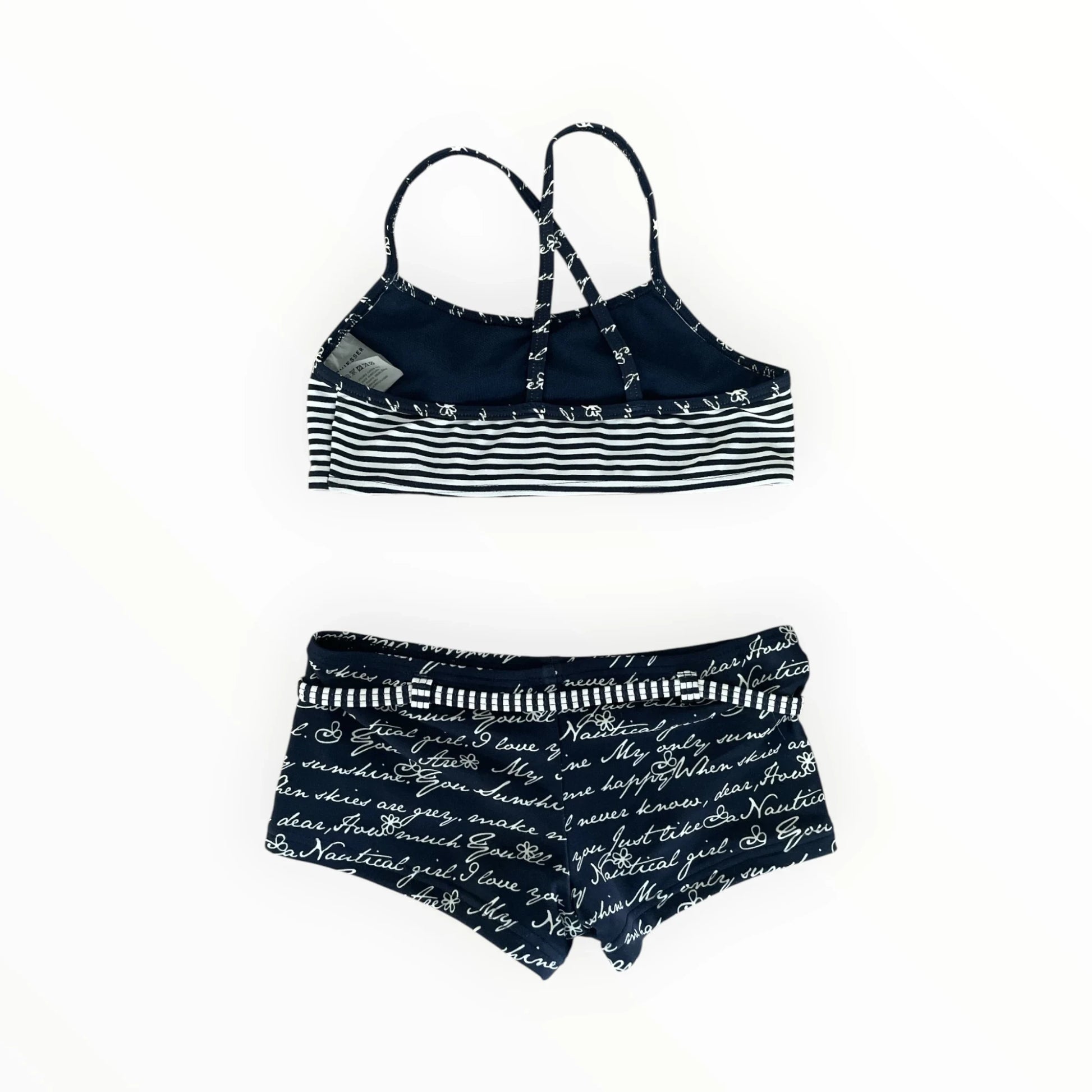 Pierrot Outlet marineblauwe meisjesbikini met tekstprint, gestreepte top met gekruiste rug en bijpassend broekje.