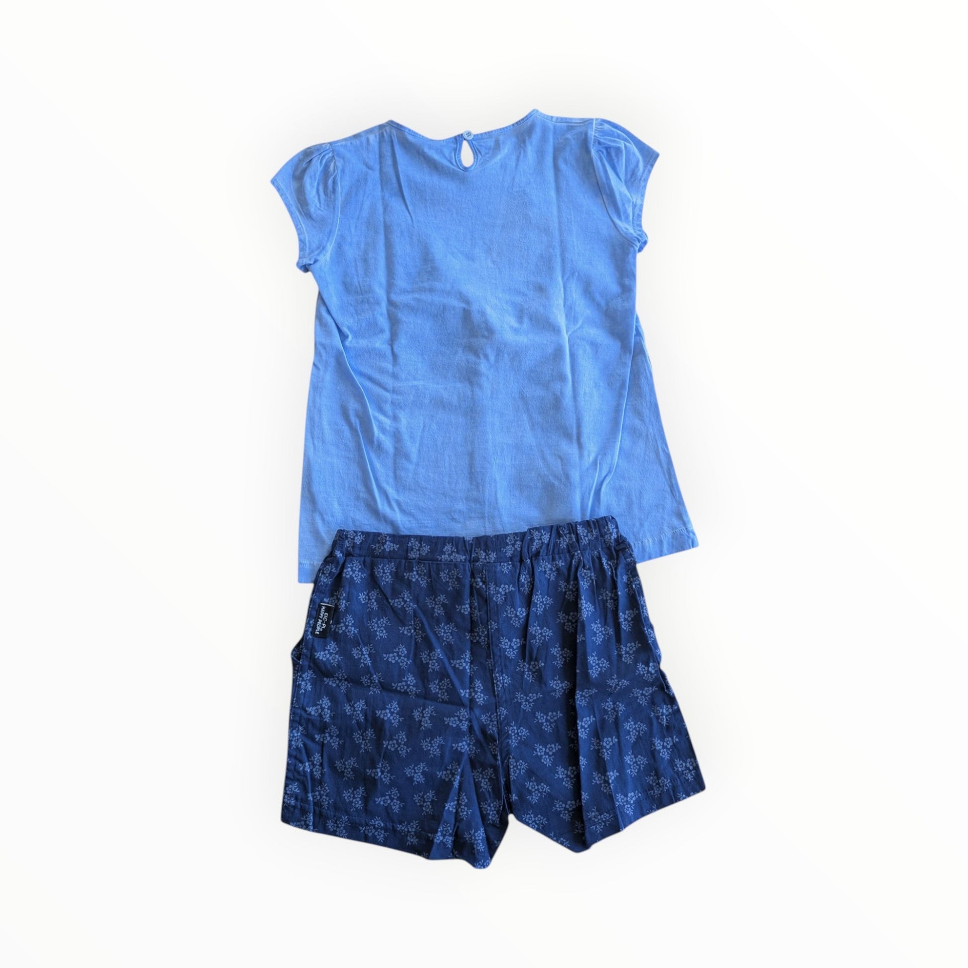 Pierrot Outlet zomerse set voor meisjes met lichtblauw t-shirt en donkerblauwe shorts met bloemenprint