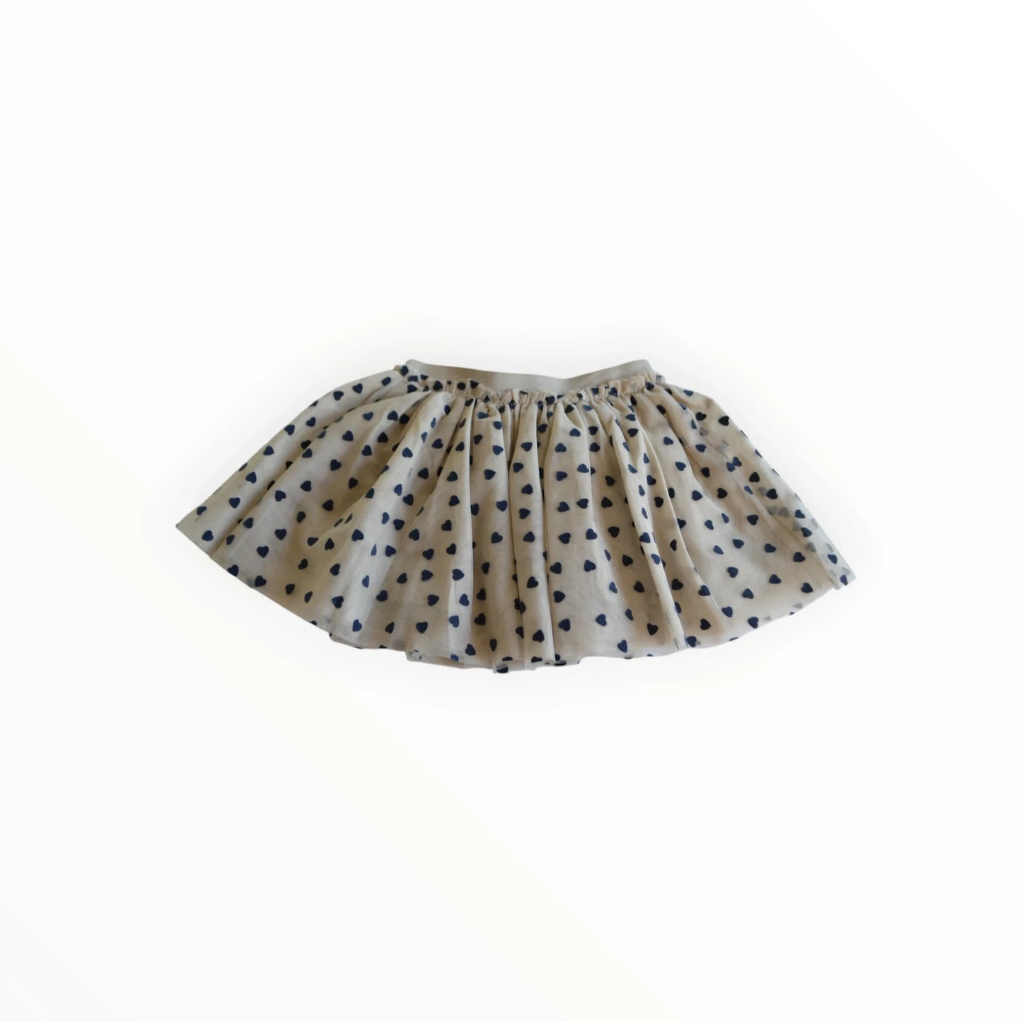 Pierrot Outlet meisjesrok met navy blauwe hartjesprint op crèmekleurige stof, elastische tailleband.