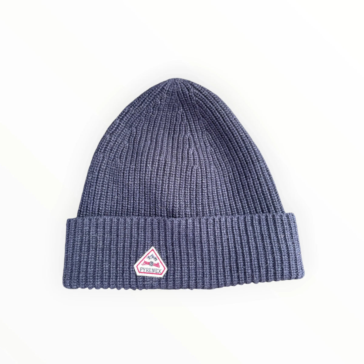 Pierrot Outlet navy blue ribbed knit beanie with a cuffed design and signature triangular Pyrenex brand patch.