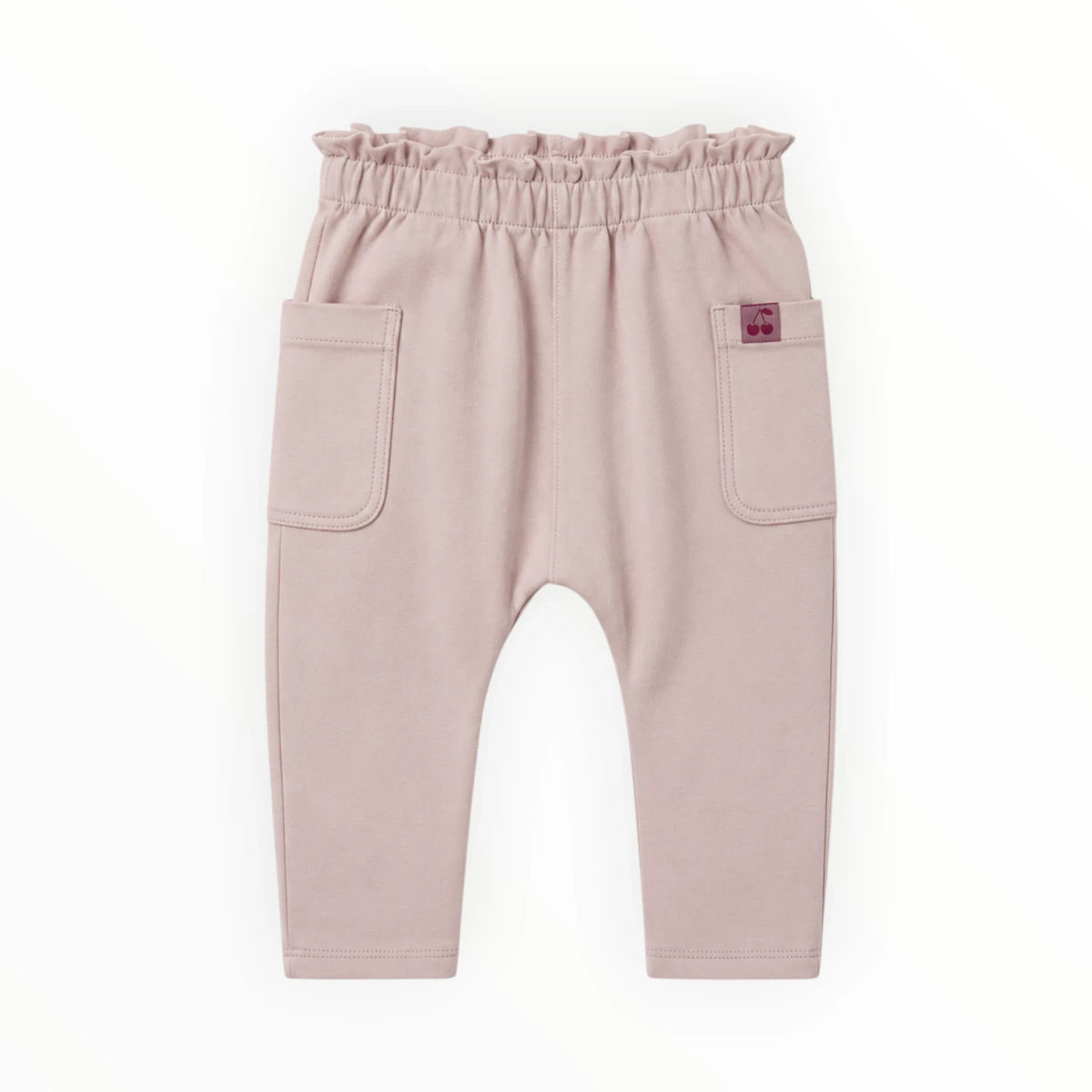 Pierrot Outlet oudroze babybroek van zacht katoen met elastische tailleband, ruches en twee opgestikte zakken.