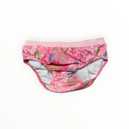 Pierrot Outlet roze zwemluierbroekje voor baby's met cirkelpatroon en gestreepte elastische tailleband.