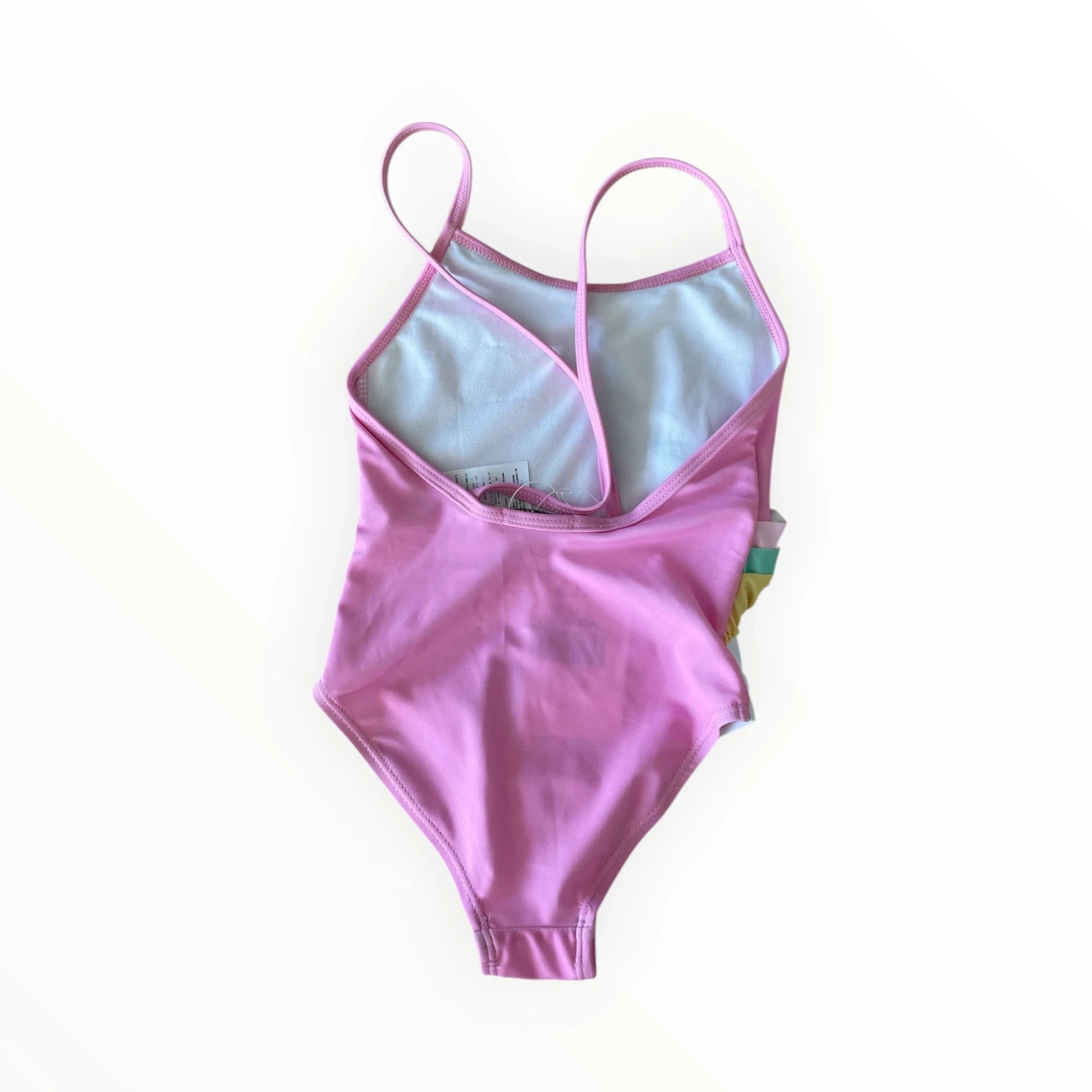 Pierrot Outlet roze eenstuk zwempak voor kinderen met eenhoorn-print, glitters en speelse ruches aan de zijkant.